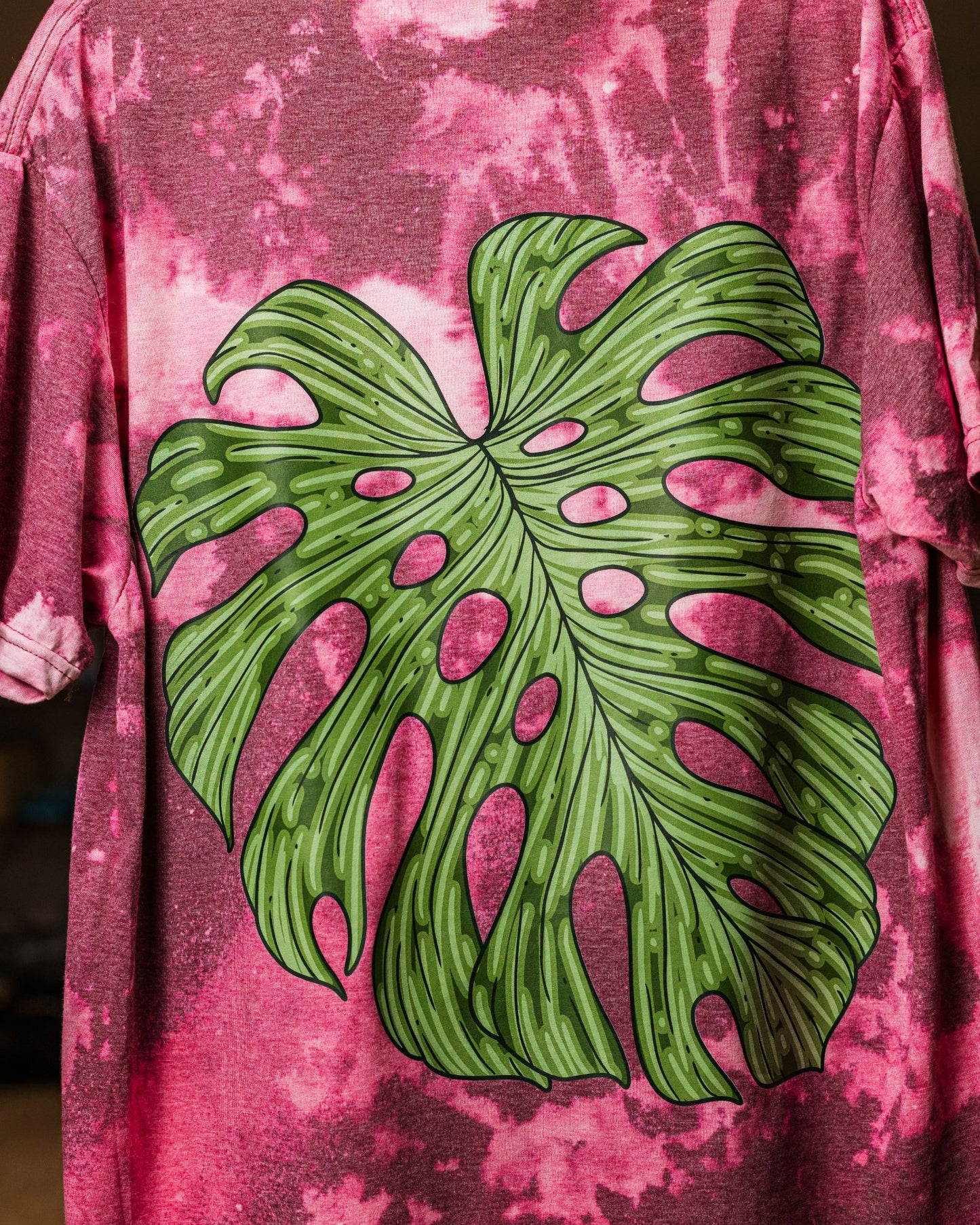 Bleached T-shirt with a monstera leaf design by RattTrap Artistry